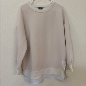 chic Cream Oversized Sweatshirt with Layered Hem and Side Zips